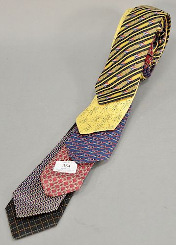 Six Hermes silk ties including yellow and black, blue, yellow, black, cranberry, and multi-colored