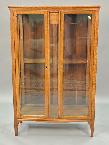 Oak two door China cabinet with glass shelves. ht. 59 1/2in., wd. 39in.
