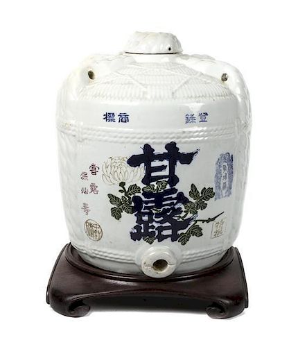 A Japanese Porcelain Sake Jar, Height 18 inches.