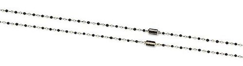 * A Pair of 18 Karat White Gold, Onyx, Cultured Seed Pearl and Diamond Station Necklaces, Bvlgari, 8.00 dwts.