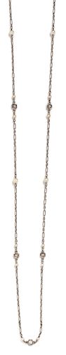 * A Platinum, Diamond and Seed Pearl Longchain Necklace, 4.70 dwts.