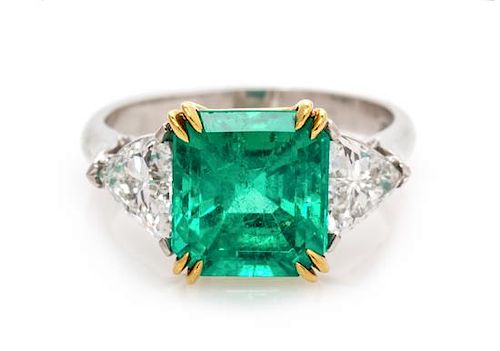 A Platinum, 18 Karat Yellow Gold, Emerald and Diamond Ring, 4.25 dwts.