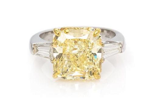 A Platinum, 18 Karat Yellow Gold, Fancy Yellow Diamond and Diamond Ring, 5.90 dwts.