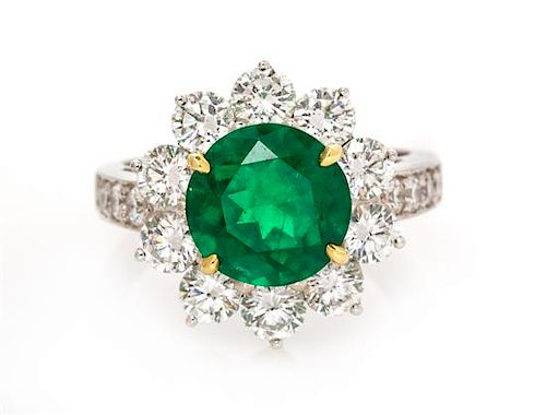 A Platinum, Yellow Gold, Emerald and Diamond Ring, 6.25 dwts.