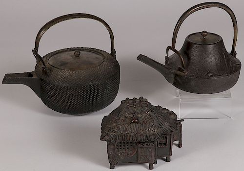 A PAIR OF JAPANESE CAST IRON TEAPOTS, 19TH C.