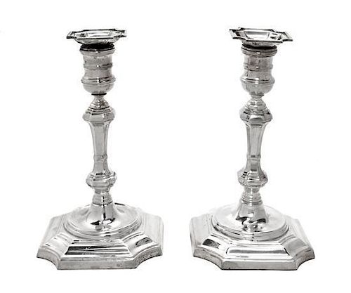 A Pair of English Silver Candlesticks, A. Chick & Sons, London, 1972, in Georgian style, the stepped square bases with cut corne
