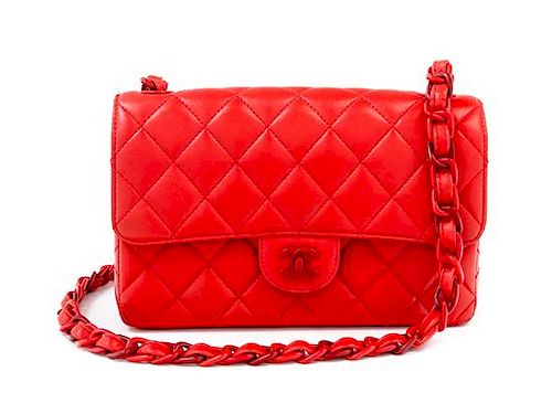 A Chanel Red Lambskin Quilted Flap Bag, 10" x 7" x 2.75"; Strap drop: 19".