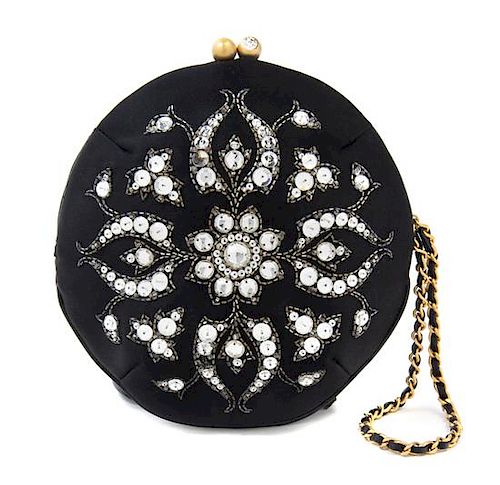 A Chanel Black Silk Embroidered Rhinestone Circular Clutch, 7" diameter.