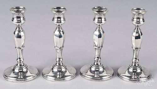 Set of four Birmingham silver candlesticks