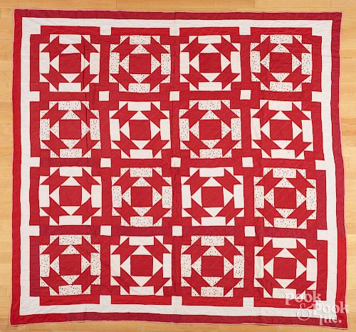Red and white pieced quilt