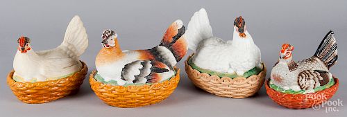 Four porcelain hen on nests