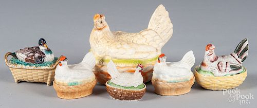 Four porcelain hen on nests, etc.