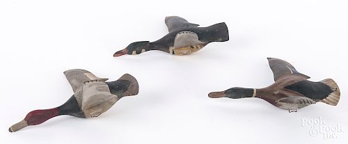 Three William Reinbold flying duck decoys