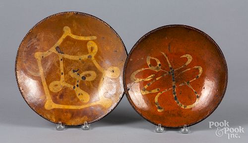 Two New England slip decorated redware plates