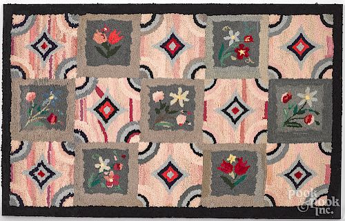 Geometric and floral hooked rug