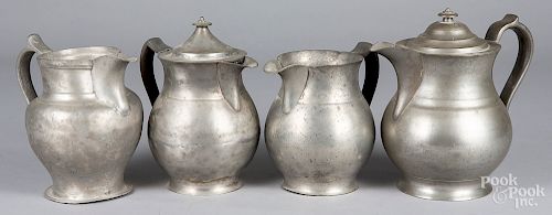 Four pewter pitchers