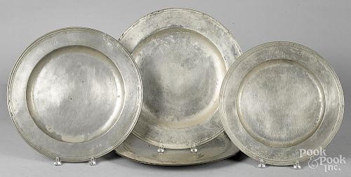 Four English pewter chargers