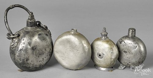Four pewter flasks