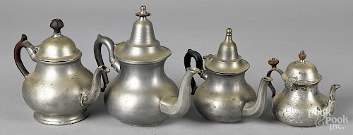 Four pear shaped pewter teapots