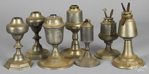 Seven American pewter oil lamps