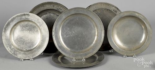 Six Continental pewter chargers and deep dishes