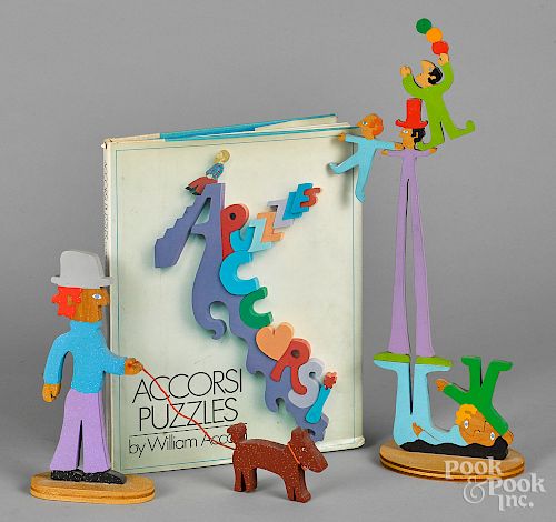 Two William Accorsi painted wood puzzle sculpture