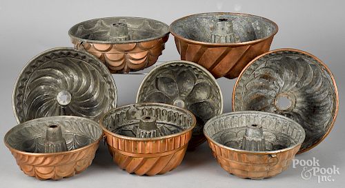 Eight copper food molds