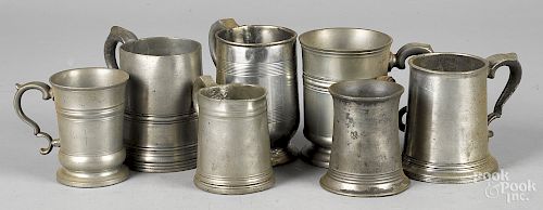 Seven English pewter mugs