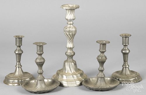 Two pairs of pewter candlesticks