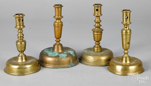 Four Dutch bell base candlesticks