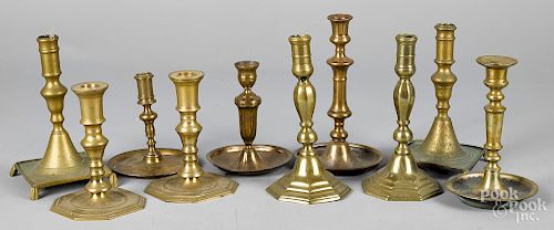 Ten assorted antique brass candlesticks