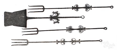 Four wrought iron fire tools