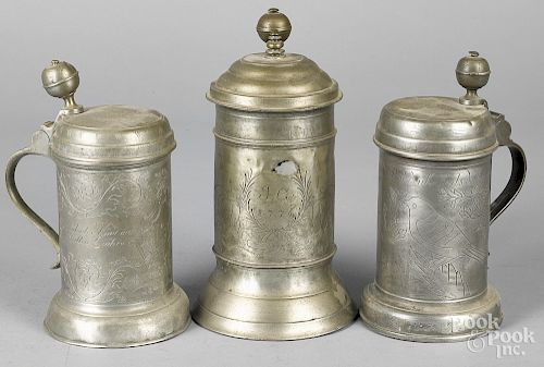 Three Continental engraved pewter tankards