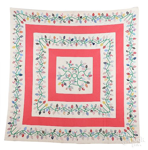 Pieced and appliqué square and floral wreath quil