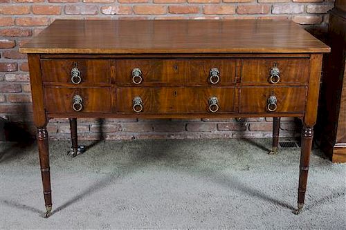 A Regency Mahogany Architects Desk, Height 35 1/4 x width 55 x depth 33 3/4 inches.