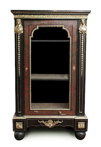 A Napoleon III Boulle Marquetry Inlaid and Gilt Metal Mounted Bookcase, Height 70 x width 39 1/2 x 16 1/2 inches.