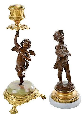 Two Patinated Bronze Figural Candlesticks