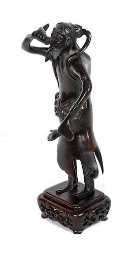 A Chinese Bronze Figure of a Foreigner, Height 6 5/8 inches.