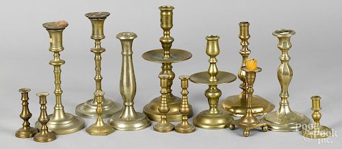 Fourteen assorted brass and base metal candlestic