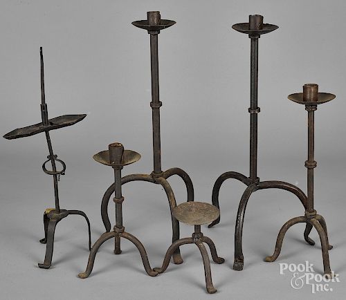 Five wrought iron candleholders