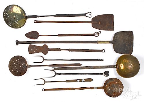 Eleven wrought iron utensils