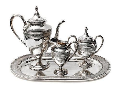 An American Silver Tea Set, International Silver Co., Meriden, CT, Wedgwood pattern, Height of first 11 3/4 inches.
