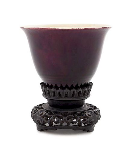 * A Chinese Aubergine Glazed Porcelain Cup Height 2 1/2 inches.