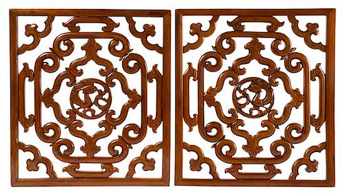 * A Pair of Chinese Huanghuali Reticulated Panels Height 20 5/8 x width 18 3/8 x depth 3/4 inches.