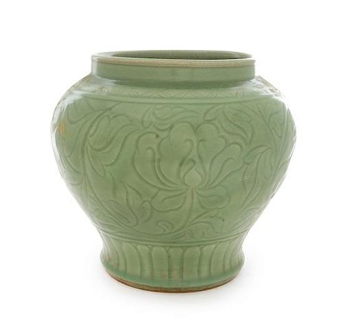 A Large Longquan Celadon Glazed Porcelain Jar Height 11 3/4 inches.