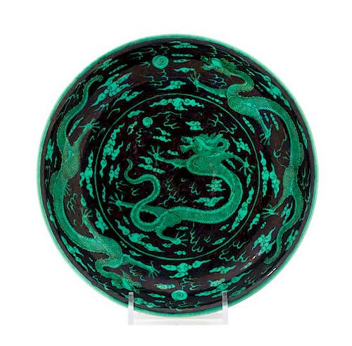 * A Black Ground Green Decorated Porcelain 'Dragon' Plate Diameter 8 inches.