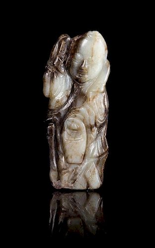 * A Black and White Jade Figure of a Standing Immortal Height 3 1/2 inches.