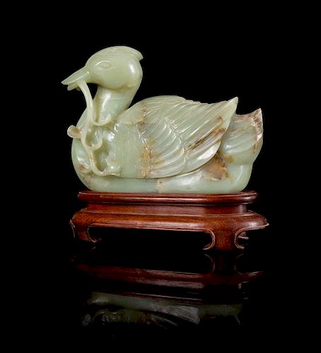 * A Celadon and Russet Jade Figure of a Duck Height 6 3/4 inches.