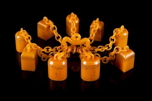 * A Set of Nine Carved Yellow Soapstone Seals Height of tallest 1 3/4 inches.