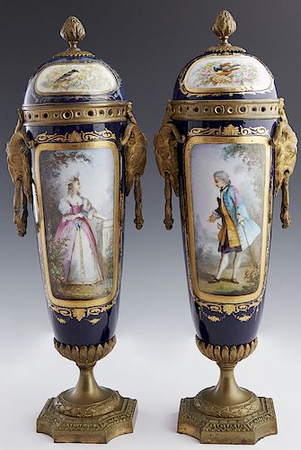 Pair of French Sevres Gilt Bronze Mounted Cobalt Porcelain Covered Vases, 19th c., with gilt decoration, the lids with bronze pineapple handles and mo